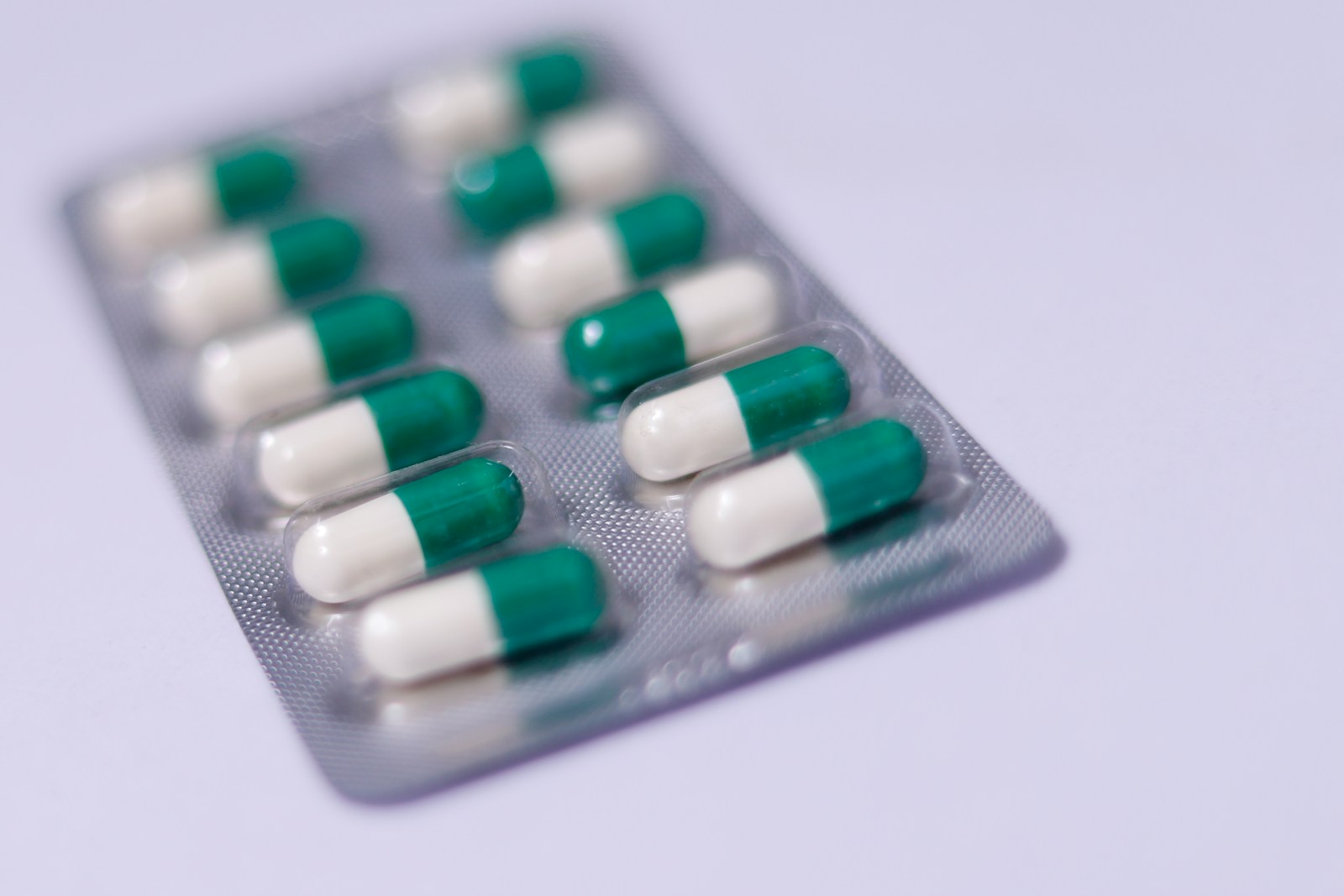 a pack of pills sitting on top of a white table